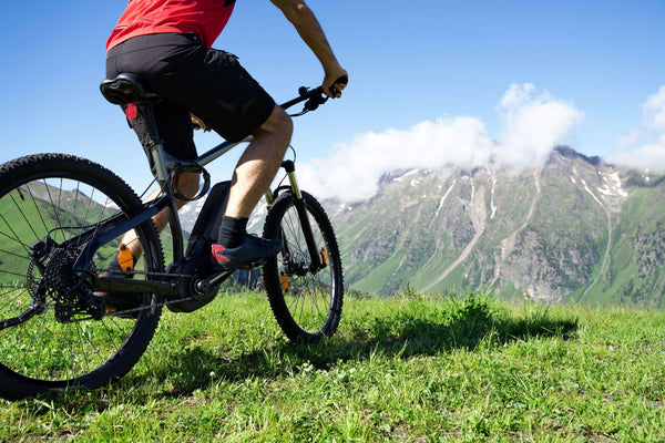 A man riding an e-bike on the mountains