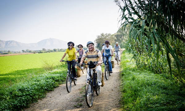 a group of tourists on an e-bike tour along a trail