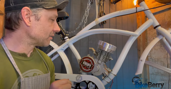 a photo of a man assembling a motorized bike