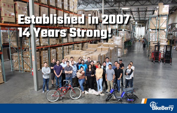 Entire Company standing in large warehouse.
