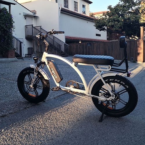 AddMotor 750W Motan M-60 R7 Comfort Fat Tire white bicycle parked outside