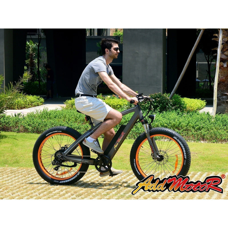 AddMotor 750W Motan M-560 P7 Sport Fat Tire man riding bicycle in grass