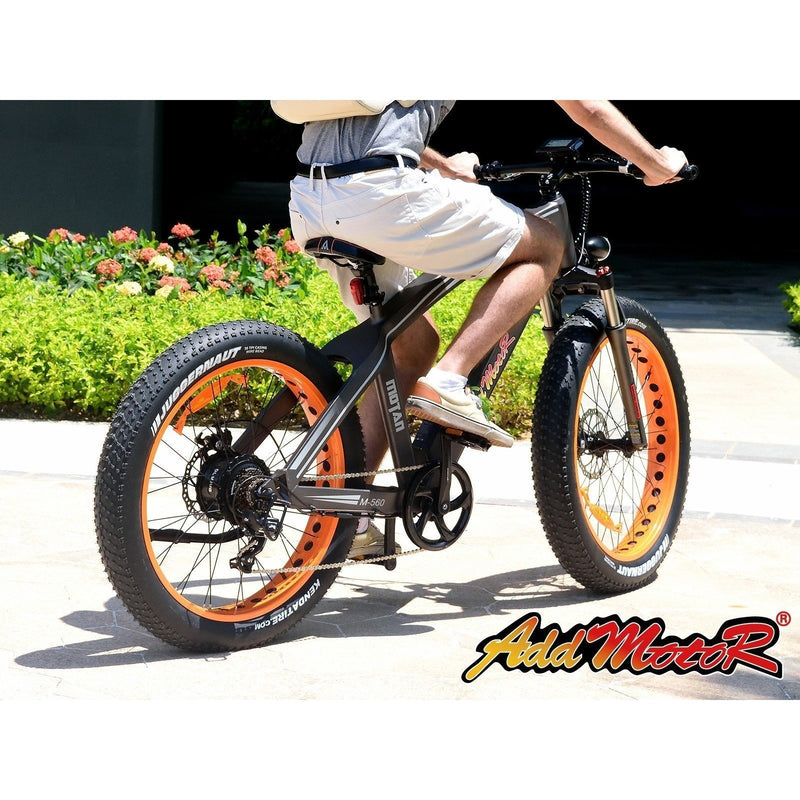 AddMotor 750W Motan M-560 P7 Sport Fat Tire man riding bicycle on pavement