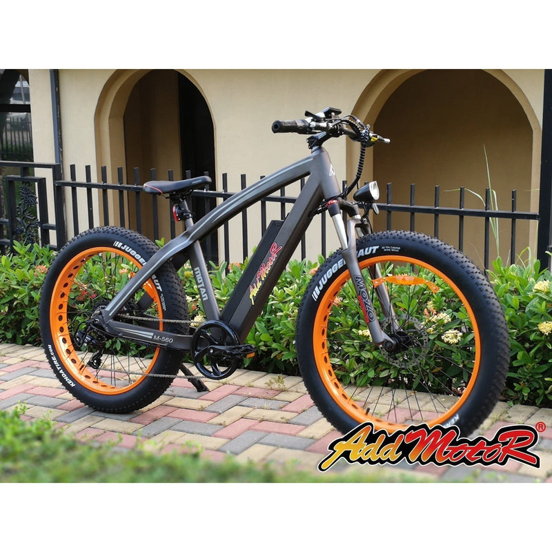 AddMotor 750W Motan M-560 P7 Sport Fat Tire bicycle parked on path