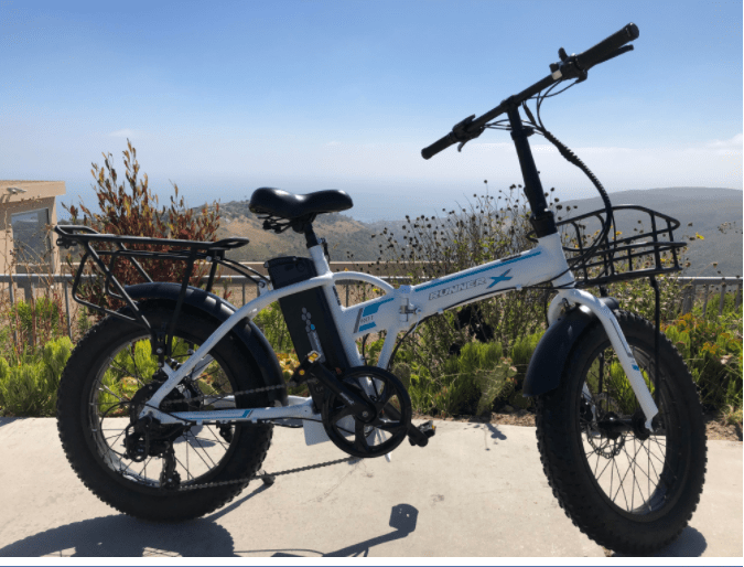 Emojo 500W Runner X 20" Fat Tire Folding bicycle parked on top of hill